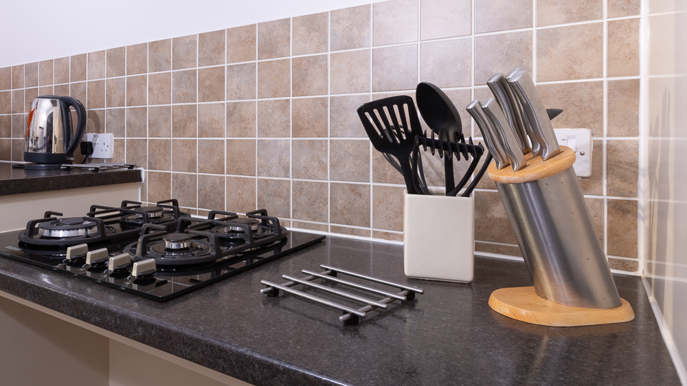 Kitchen has a gas hob, and a range of Kitchen utensils and pans for your use.